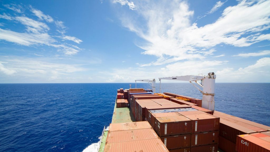 brown wooden dock on blue sea under blue sky during daytime